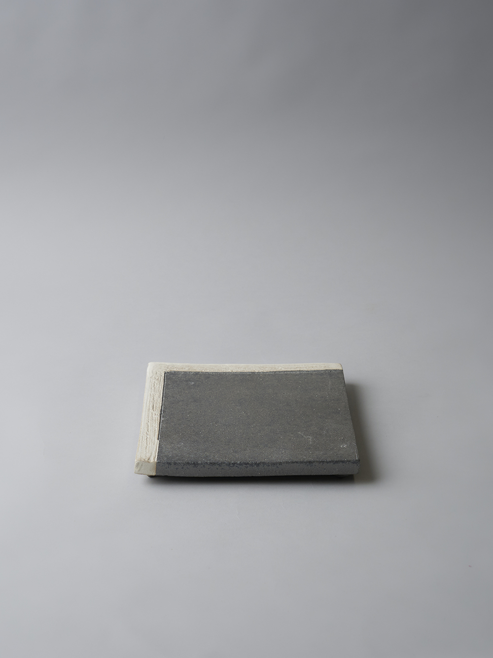 6.6 Footed Square Plate<br />Black yohen, two tone glaze