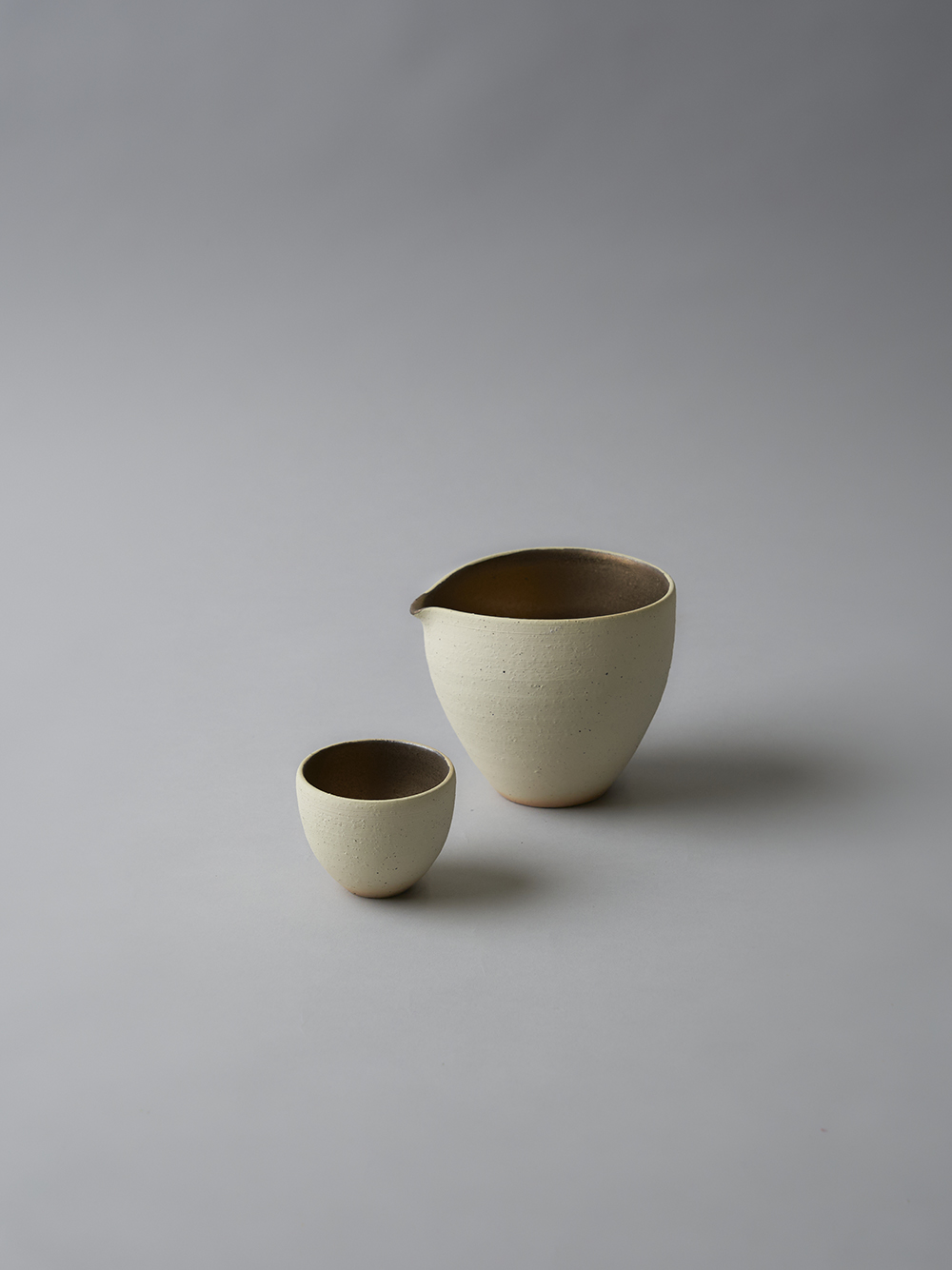 Pouring Vessel / Guinomi<br />Gold accented interior / Unglazed exterior