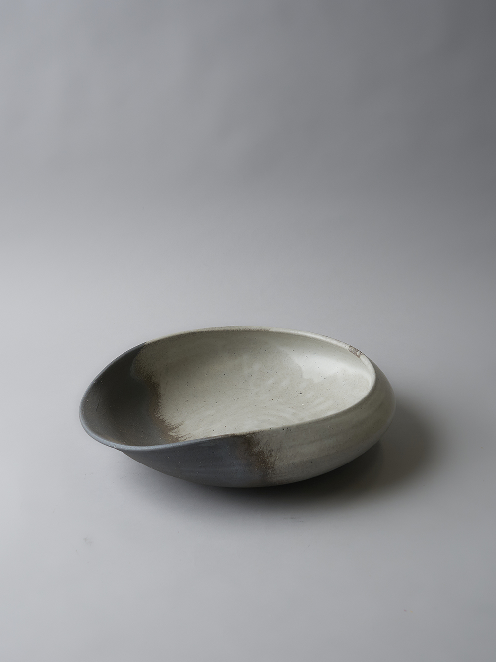 11.0 / 13.0 Irregular-Shaped Bowl<br />Ash and white clay glaze